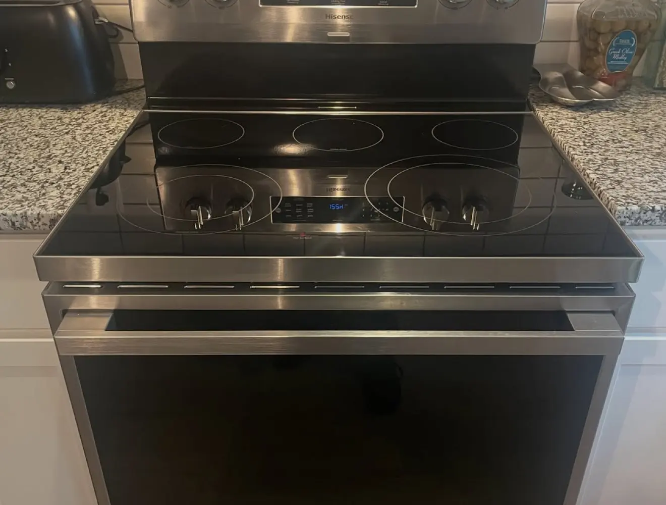An electric stove with a glass top