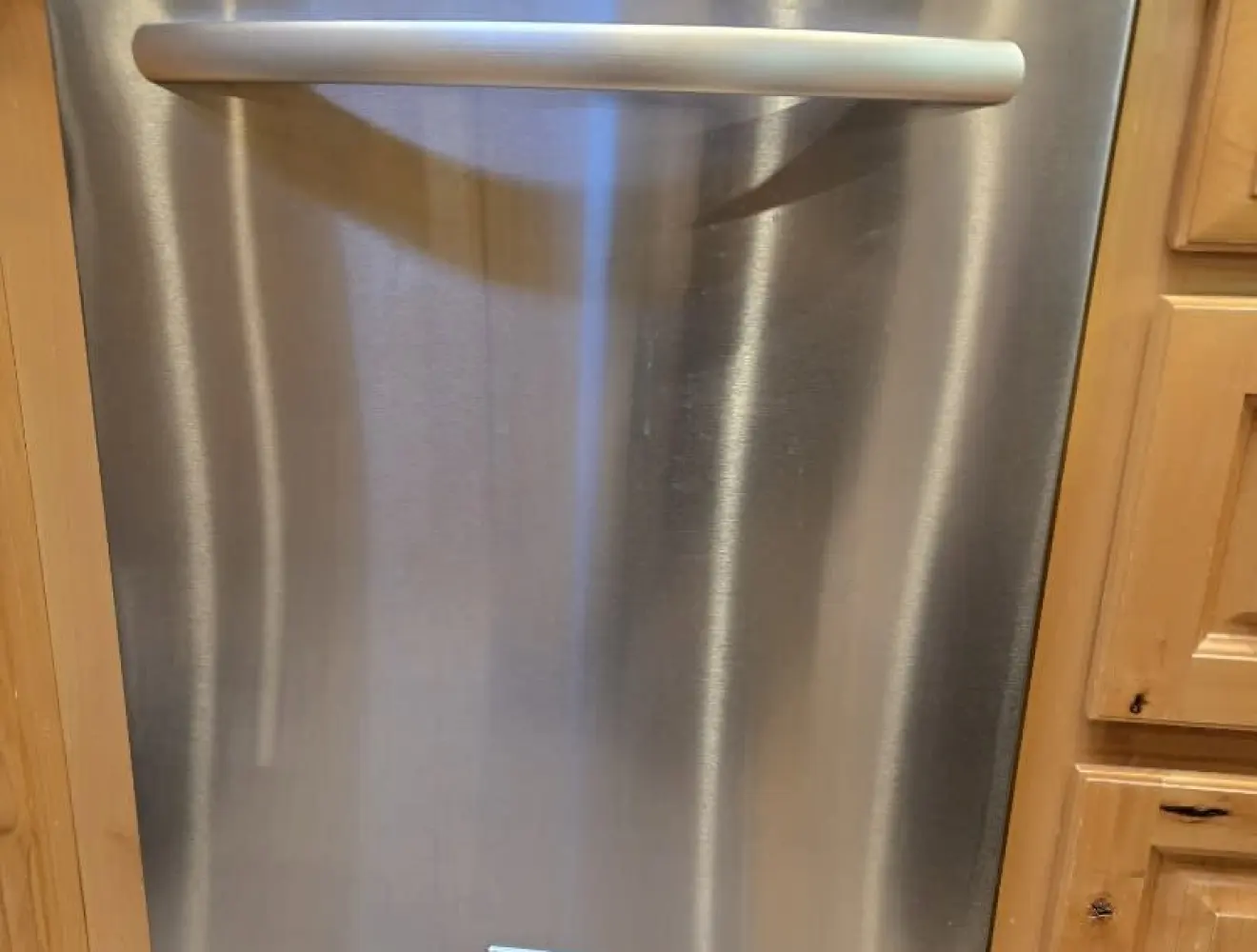 A stainless steel built-in dishwasher