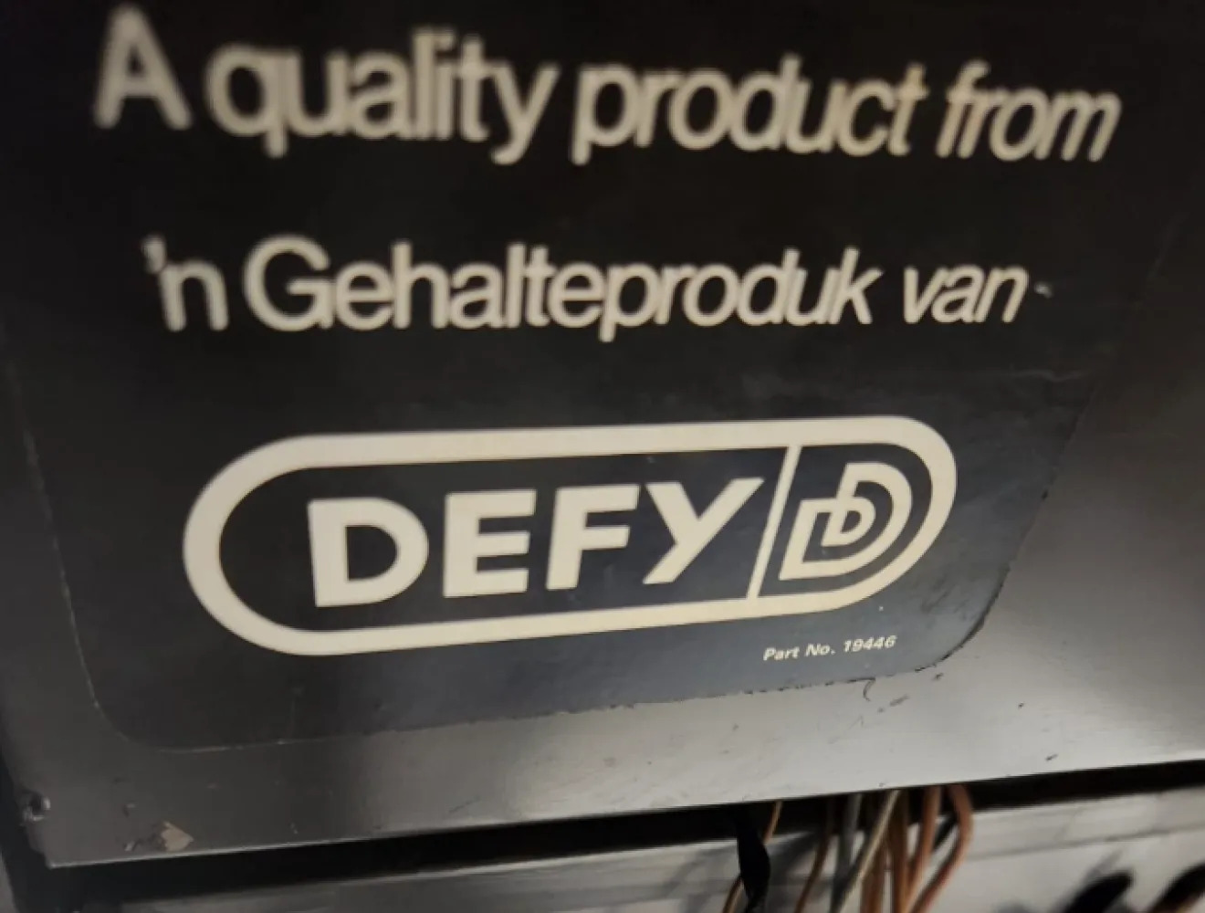 Defy appliance label on a unit opened for repair