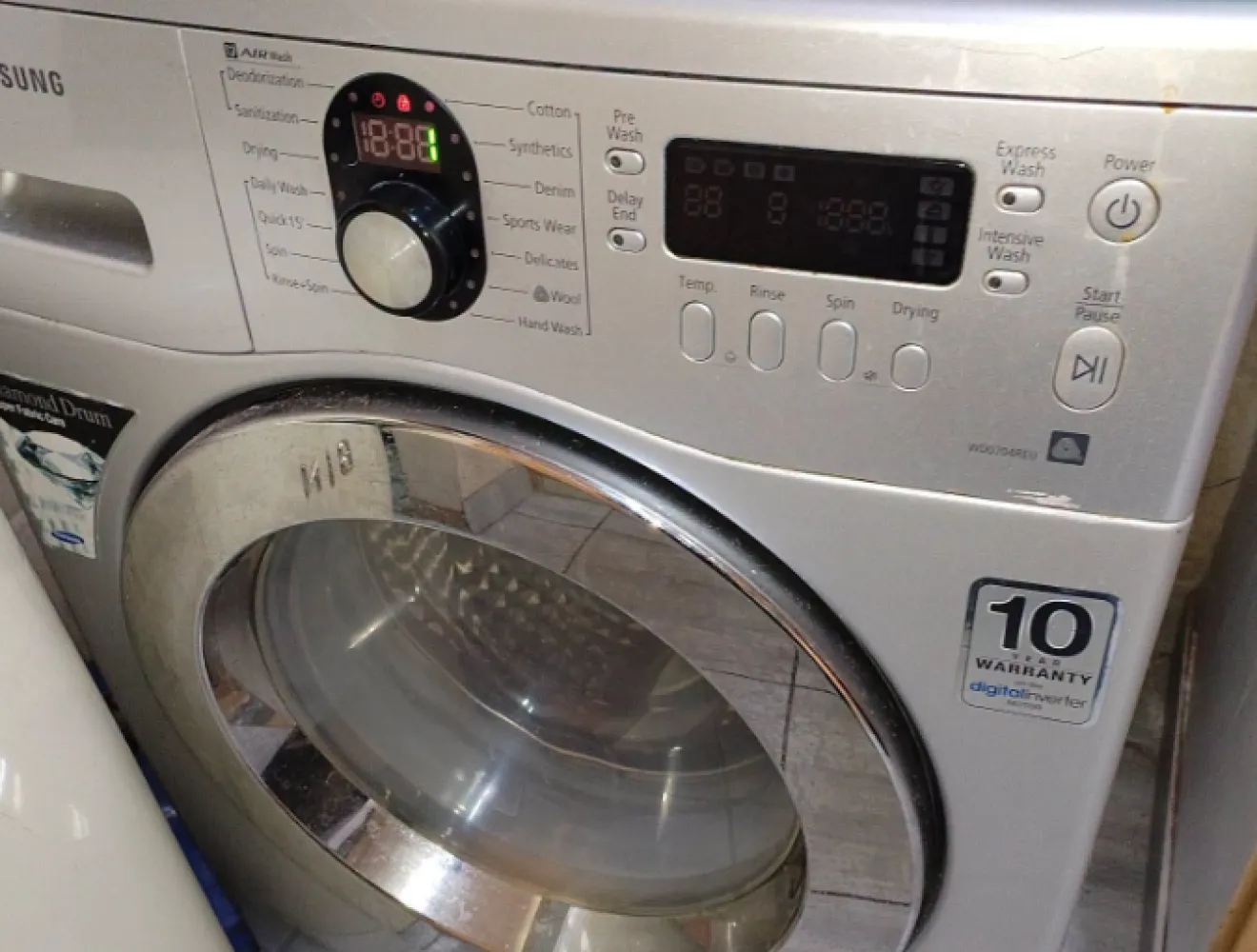 Samsung front-loader washing machine in a customer kitchen