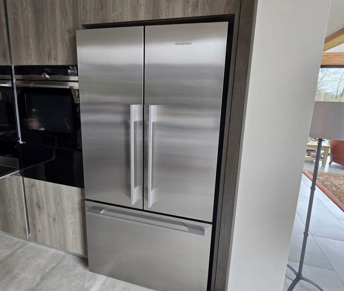 A stainless steel fridge in a modern kitchen